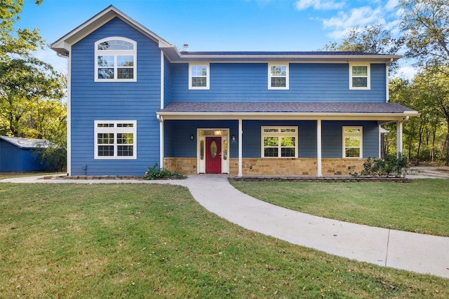 view of front property with covered porch and a front lawn