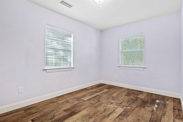 unfurnished room featuring hardwood / wood-style floors