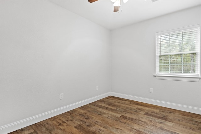 spare room with hardwood / wood-style floors and ceiling fan