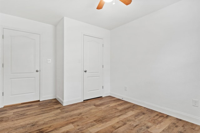 unfurnished bedroom featuring ceiling fan and light hardwood / wood-style floors