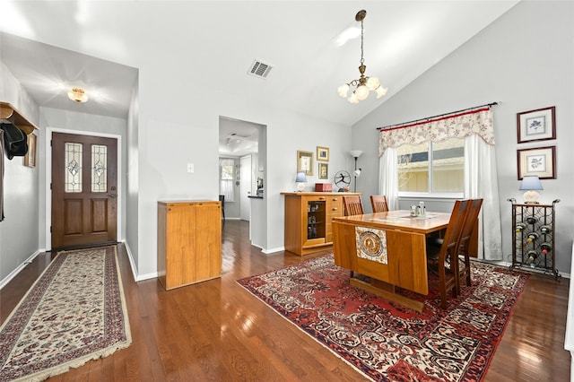 dining room featuring vaulted ceiling, a notable chandelier, and dark hardwood / wood-style floors