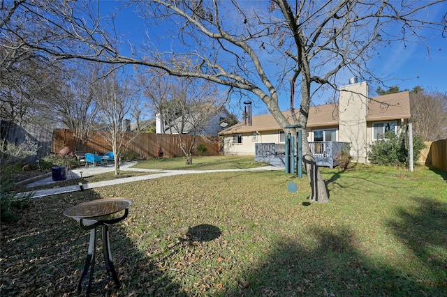 view of yard featuring a wooden deck