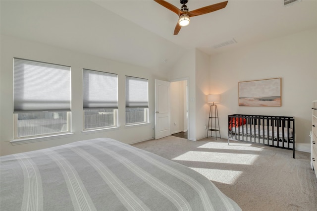 carpeted bedroom featuring vaulted ceiling and ceiling fan