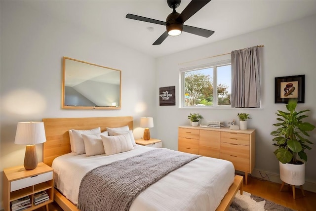 bedroom featuring hardwood / wood-style floors and ceiling fan