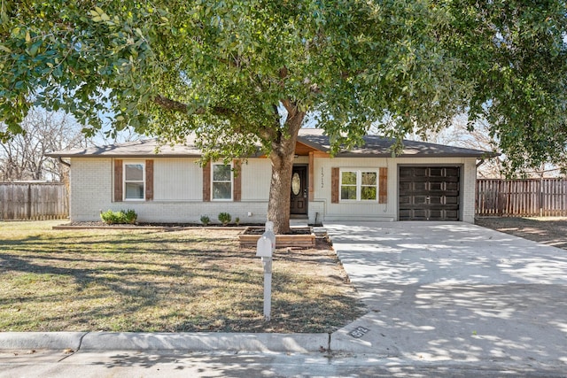 single story home with a front lawn and a garage