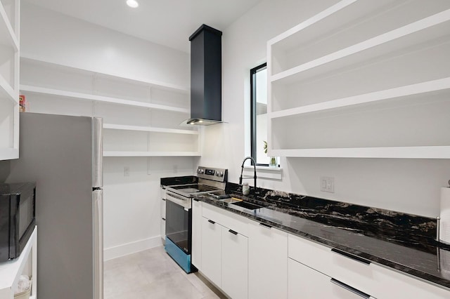 kitchen featuring stainless steel appliances, dark stone counters, white cabinets, extractor fan, and sink