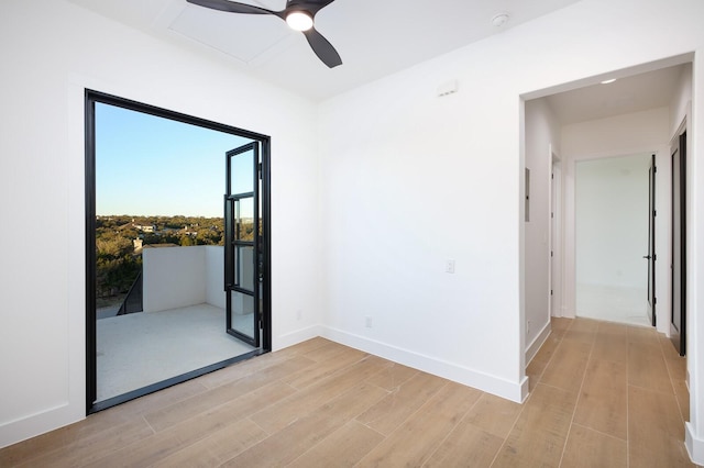 spare room with ceiling fan and light hardwood / wood-style floors