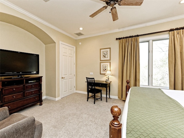 carpeted bedroom with ceiling fan, crown molding, and multiple windows