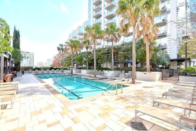 view of swimming pool with a patio