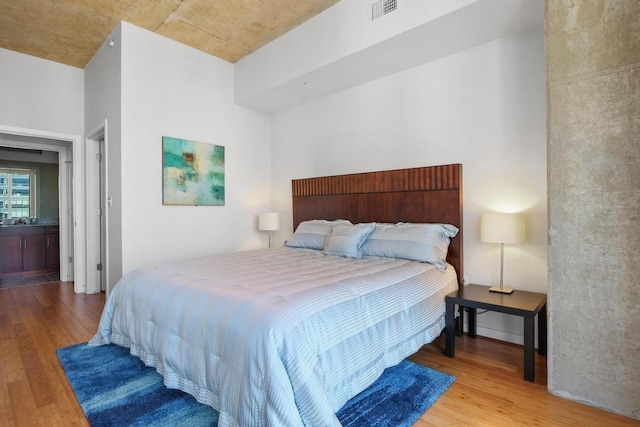360 Nueces St Unit 1318, Austin, TX 78701 - bedroom with wood finished floors