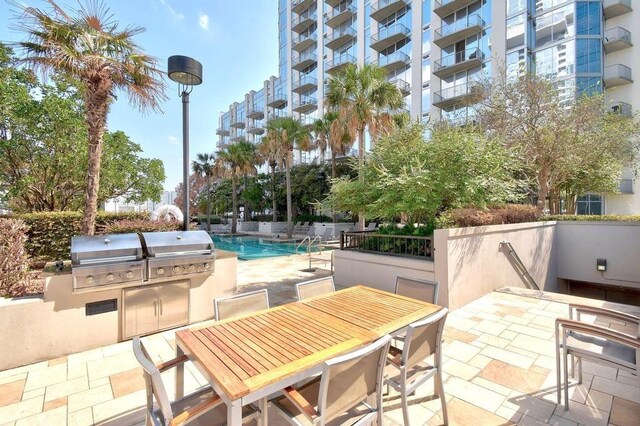 view of patio / terrace featuring exterior kitchen and grilling area