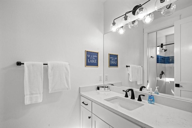 bathroom featuring an enclosed shower and vanity