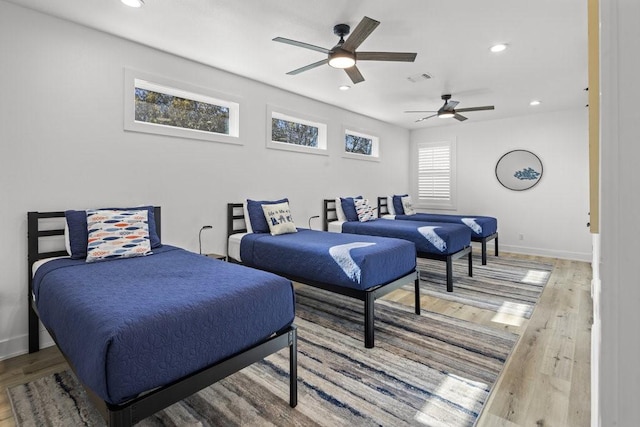 bedroom featuring ceiling fan and wood-type flooring