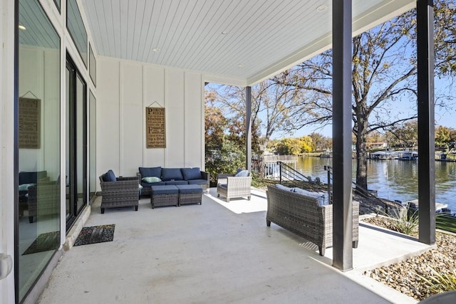 view of patio / terrace featuring an outdoor living space and a water view