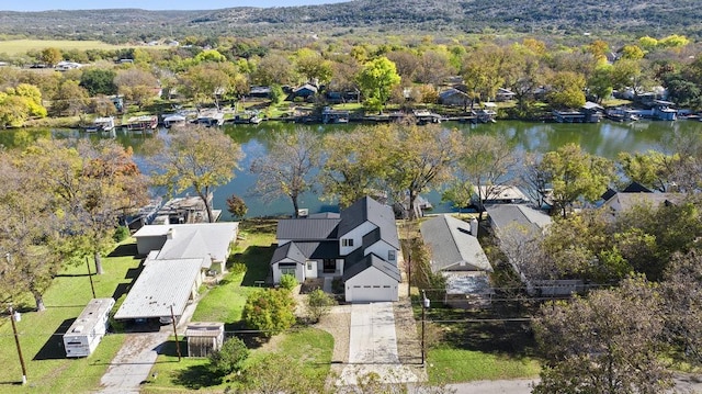 birds eye view of property with a water view