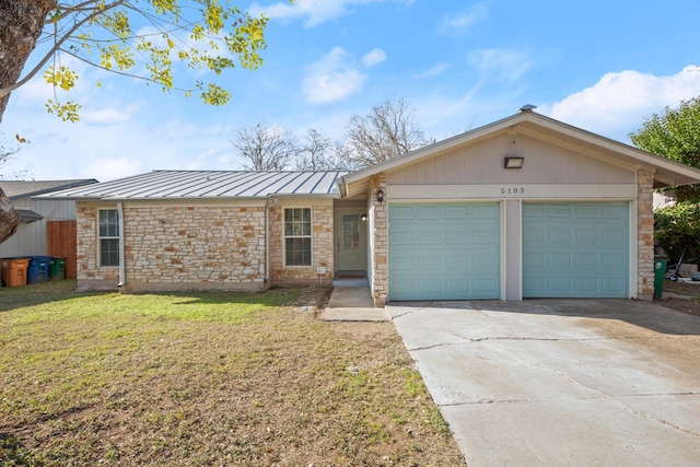 single story home with a front lawn and a garage