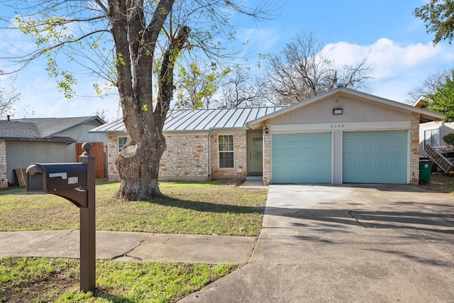 single story home featuring a front yard and a garage