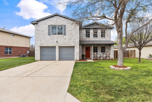 front facade featuring a front yard, a garage, and central AC unit