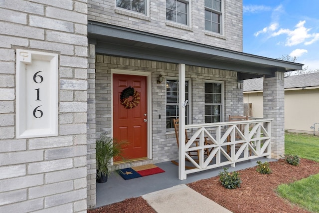 property entrance with covered porch