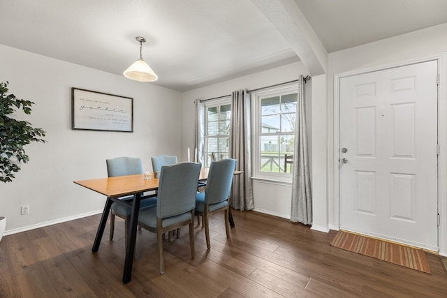 dining area with dark hardwood / wood-style floors