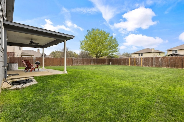 view of yard featuring ceiling fan and a patio area