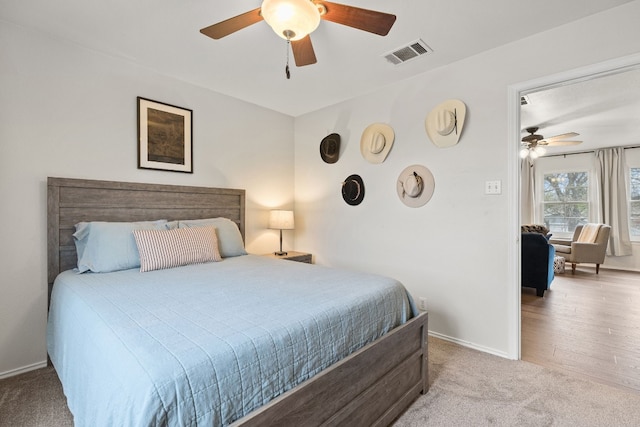 carpeted bedroom with ceiling fan