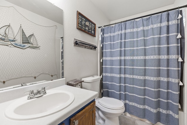 bathroom featuring vanity, curtained shower, tile patterned floors, and toilet