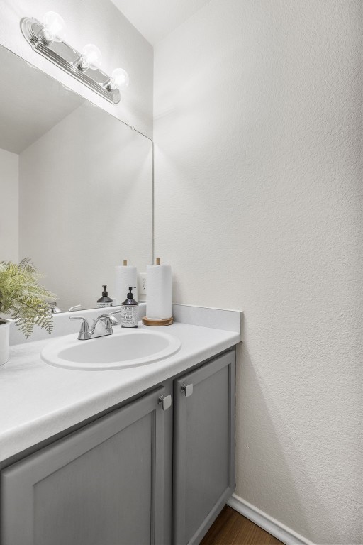 bathroom with vanity and hardwood / wood-style floors