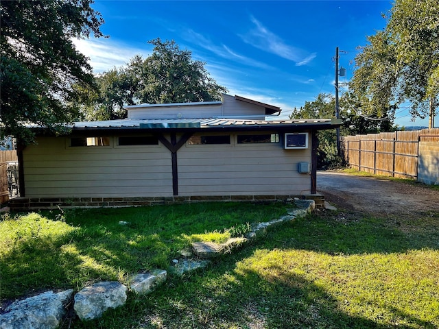 view of side of property featuring a yard