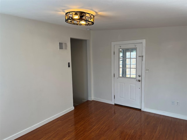 foyer entrance with dark hardwood / wood-style floors