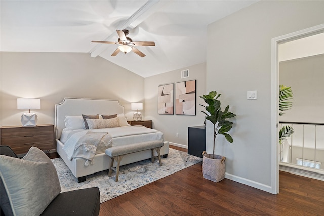 bedroom with ceiling fan, dark hardwood / wood-style floors, and vaulted ceiling with beams