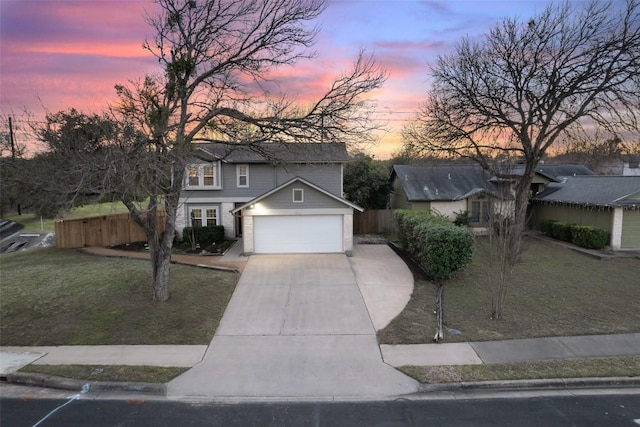 view of front facade with a lawn and a garage