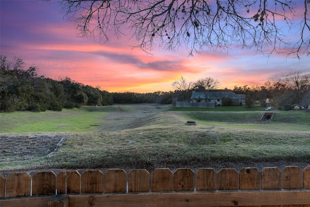 view of yard at dusk