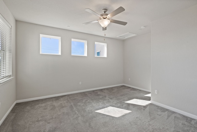 carpeted spare room with ceiling fan