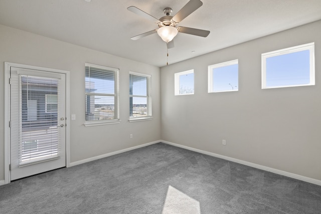 unfurnished room featuring ceiling fan and carpet