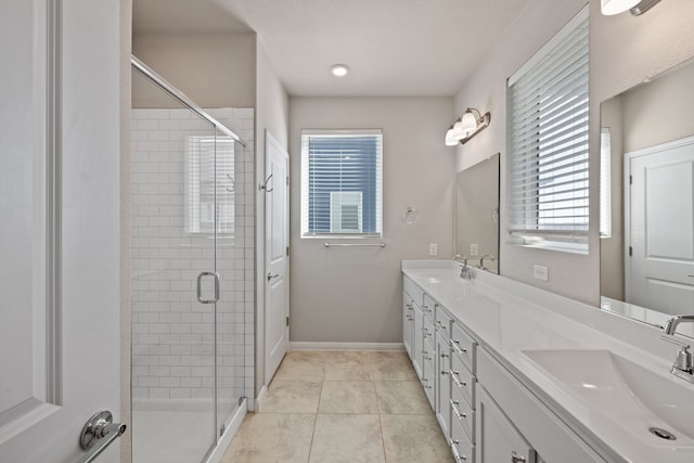 bathroom featuring walk in shower, vanity, and tile patterned floors