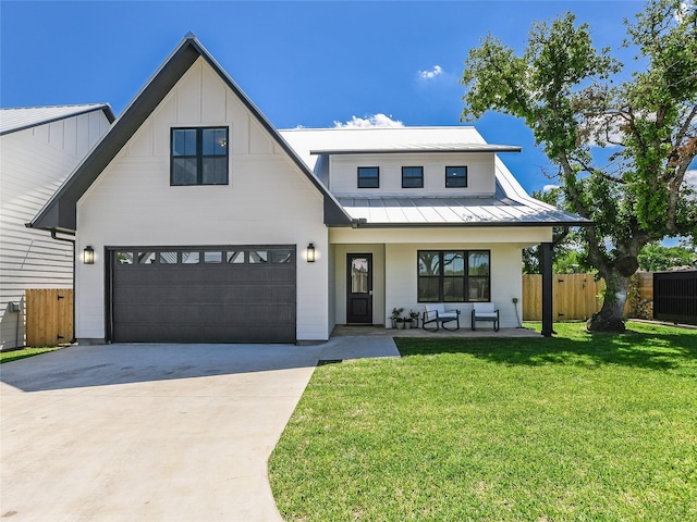 modern farmhouse style home featuring a porch, a front lawn, and a garage