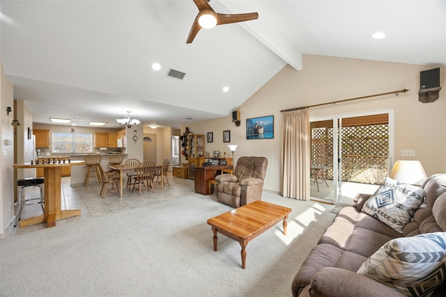 living room with light carpet, ceiling fan with notable chandelier, high vaulted ceiling, and beamed ceiling