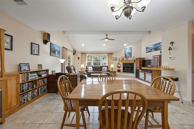 tiled dining area featuring vaulted ceiling with beams and ceiling fan with notable chandelier