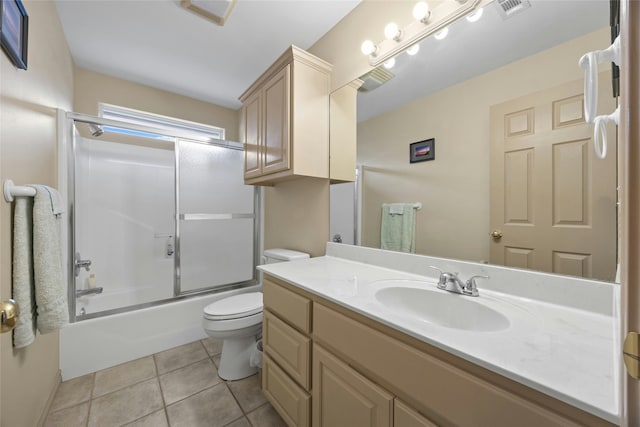 full bathroom with vanity, tile patterned floors, shower / bath combination with glass door, and toilet