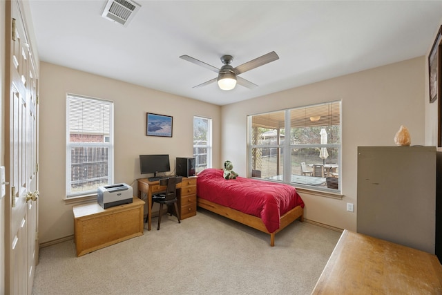 bedroom featuring light colored carpet and ceiling fan