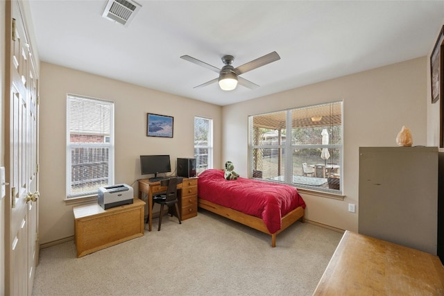 1505 E Johnson St, Burnet, TX 78611 - carpeted bedroom with a desk and a ceiling fan