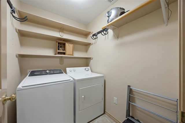 clothes washing area featuring laundry area and independent washer and dryer