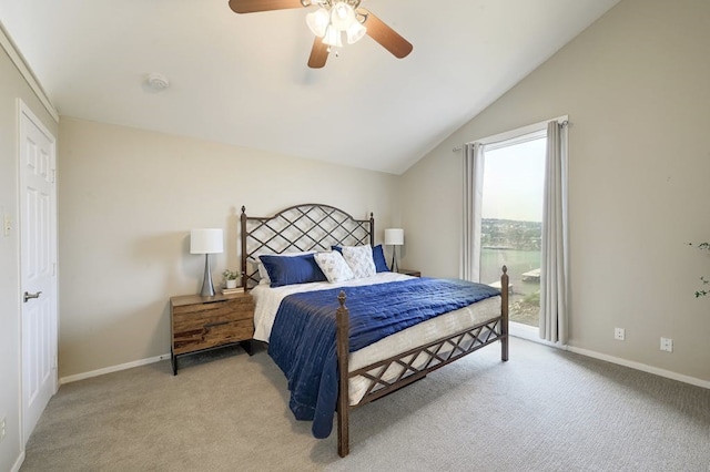 carpeted bedroom featuring vaulted ceiling and ceiling fan