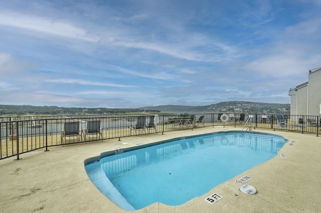 view of pool with a mountain view