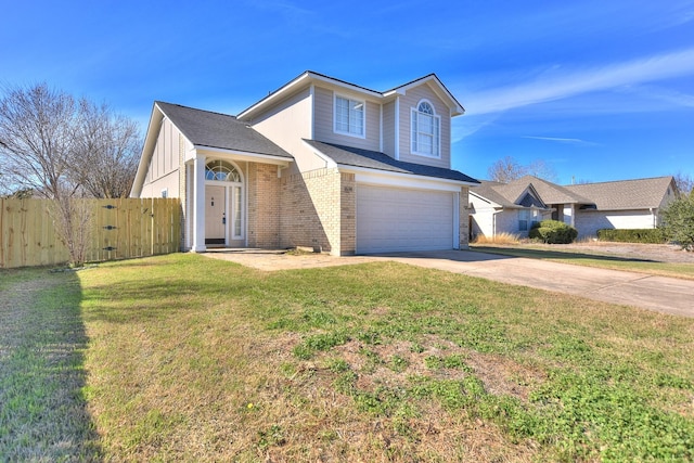 view of front of home with a garage and a front lawn