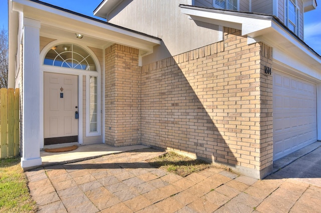 doorway to property featuring a garage