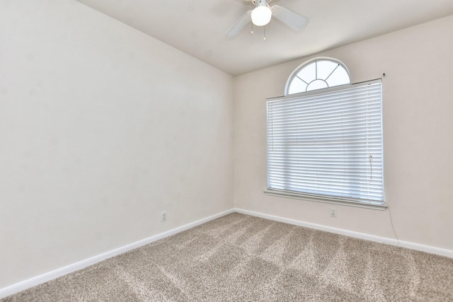 unfurnished room with ceiling fan and carpet floors