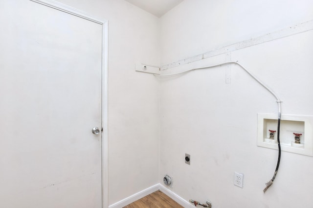 laundry area featuring hardwood / wood-style floors, hookup for a gas dryer, electric dryer hookup, and washer hookup