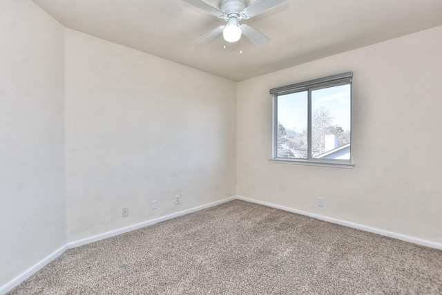 unfurnished room featuring ceiling fan and carpet floors